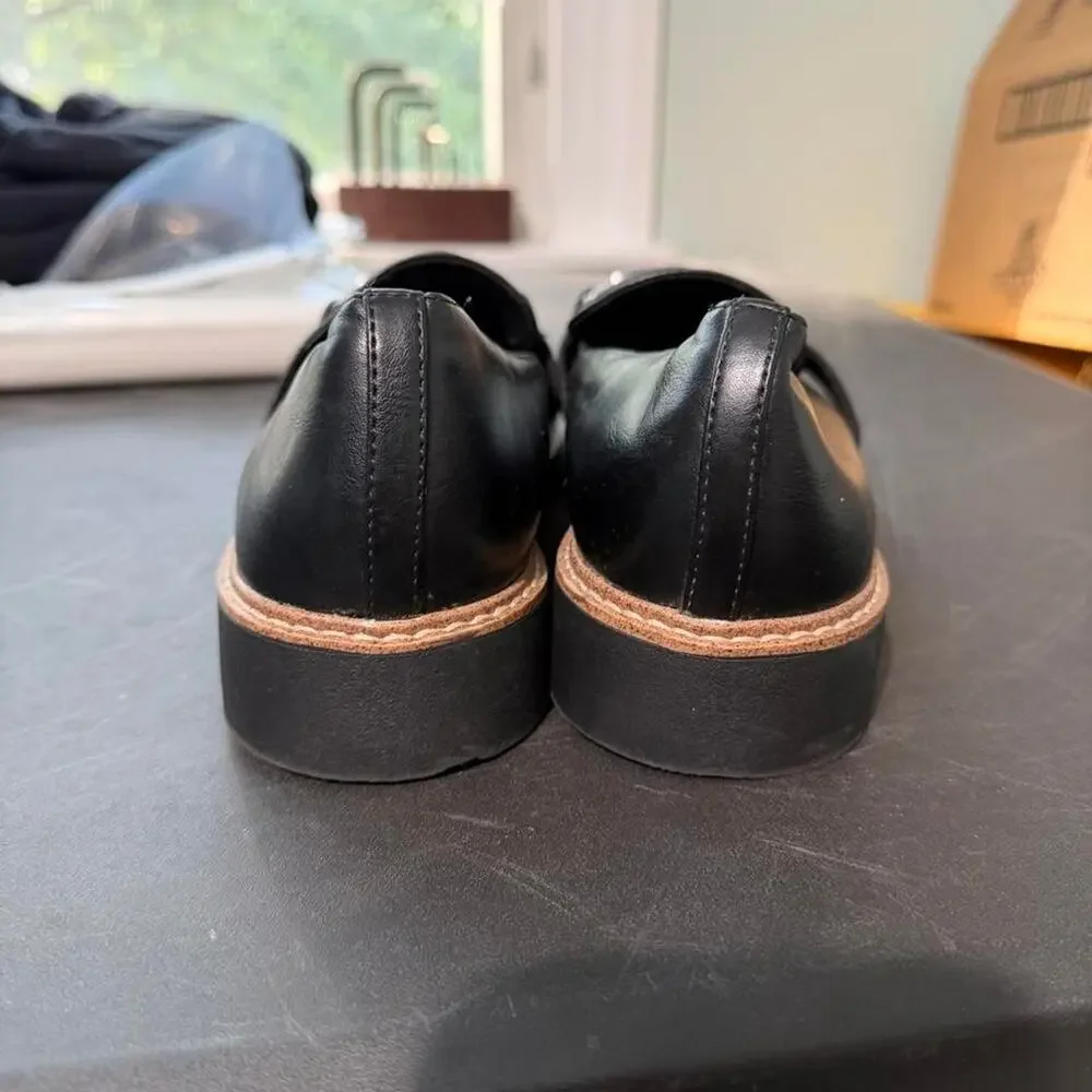 Black leather loafers with silver